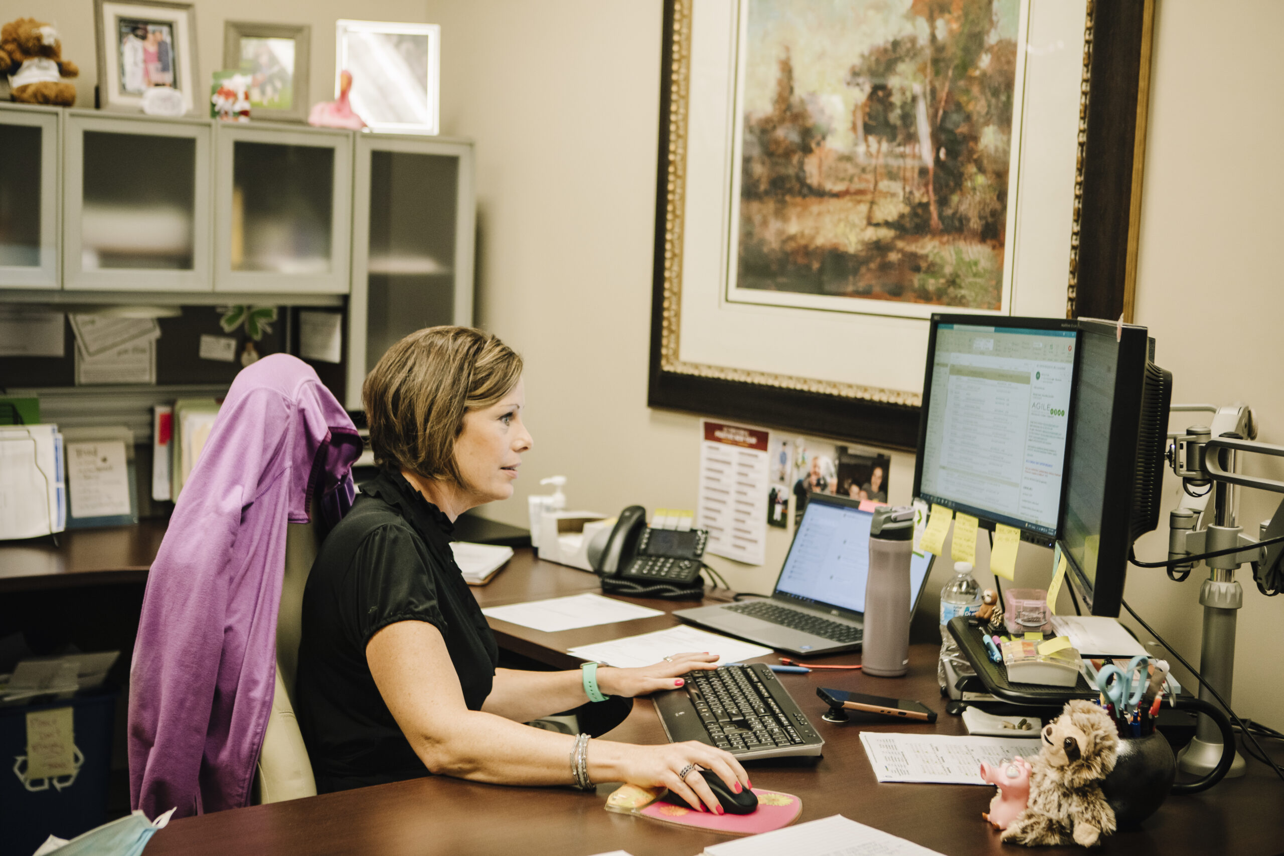 Wendy, HR, working at her desk